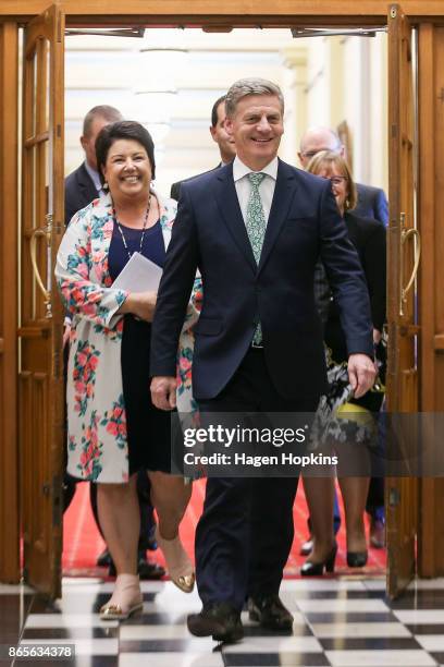 National Party leader Bill English and deputy leader Paula Bennett look on after getting stuck behind a security door on their way to a post caucus...