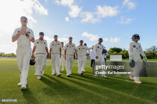 James Neesham of Otago and his team mates walk from the ground at the end of day two during the Plunket Shield match between Canterbury and the Otago...