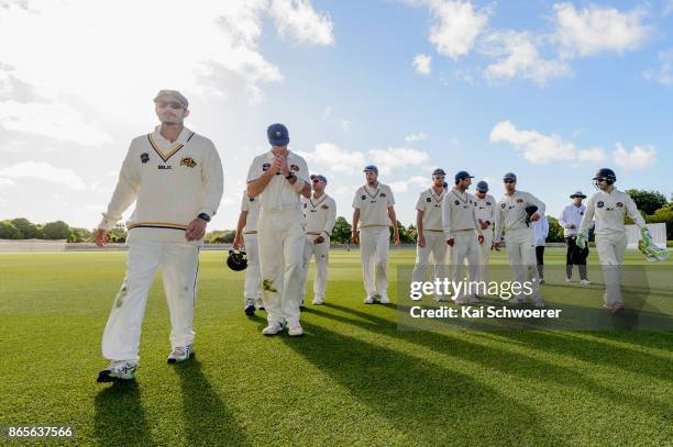 Rob Nicol of Otago and his team mates walk from the ground at the end of day two during the Plunket Shield match between Canterbury and the Otago...