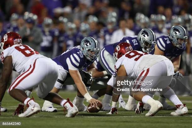 Kansas State Wildcats offensive lineman Adam Holtorf and Oklahoma Sooners defensive tackle Marquise Overton square before the snap in the fourth...