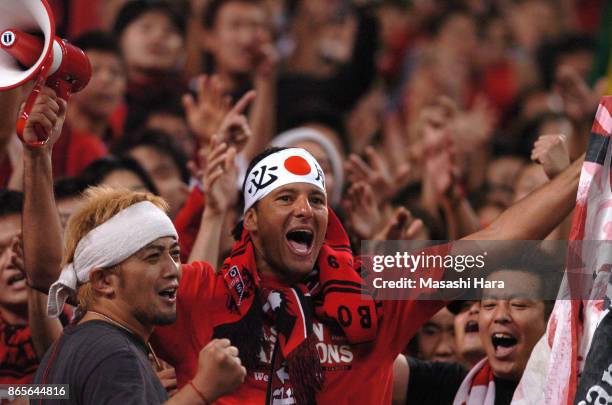 Washington of Urawa Red Diamonds celebrates with supporters after the AFC Champions League final second leg match between Urawa Red Diamonds and...