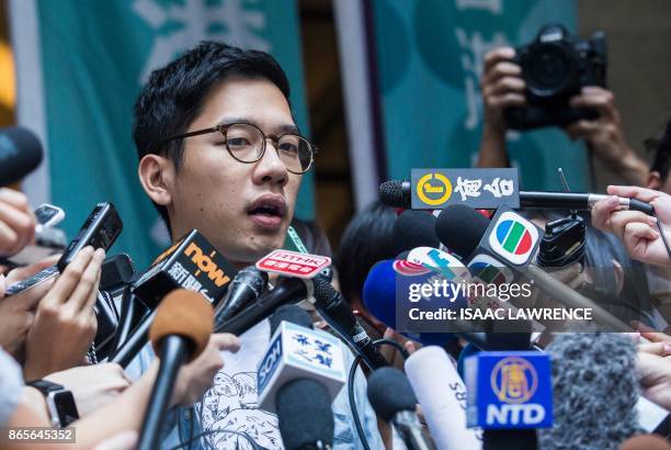 Pro-democracy activists Nathan Law speaks to the media out side the Court of Final Appeal after he and Joshua Wong's bail application were successful...