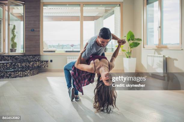 happy couple in love dancing in an empty apartment. - young couple dancing stock pictures, royalty-free photos & images