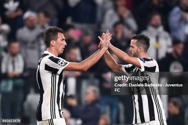 Mario Mandzukic celebrates 2-1 goal with Miralem Pjanic during the UEFA Champions League group D match between Juventus and Sporting CP at Juventus...