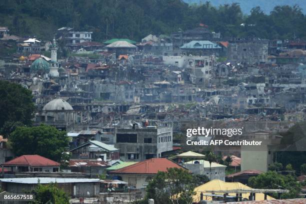 General view of destroyed buildings and homes are seen at the main battle area of Marawi on the southern island of Mindanao on October 24 a day after...