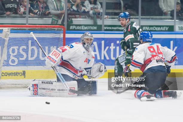 Dennis Endras of Adler Mannheim , Gabe Guentzel of Augsburger Panther and Phil Hungerecker of Adler Mannheim battle for the ball during the DEL match...