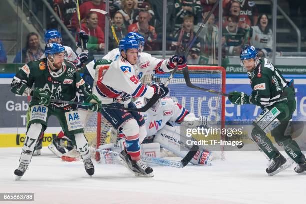 Thomas Holzmann of Augsburger Panther , Luke Adam of Adler Mannheim , Dennis Endras of Adler Mannheim and Drew LeBlanc of Augsburger Panther battle...