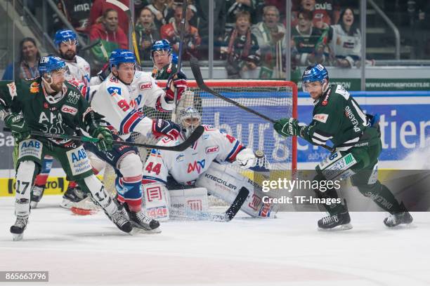 Thomas Holzmann of Augsburger Panther , Luke Adam of Adler Mannheim , Dennis Endras of Adler Mannheim and Drew LeBlanc of Augsburger Panther battle...