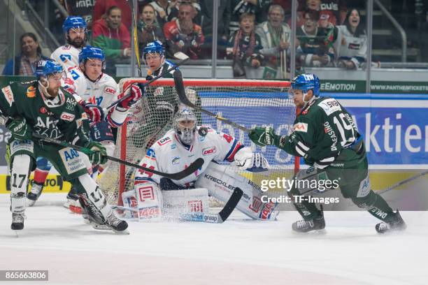 Thomas Holzmann of Augsburger Panther , Luke Adam of Adler Mannheim , Dennis Endras of Adler Mannheim and Drew LeBlanc of Augsburger Panther battle...