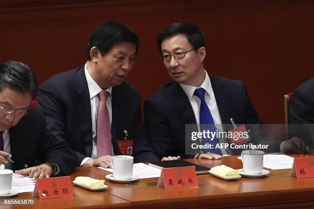 Han Zheng , secretary of the Shanghai Municipal Party Committee and member of the Political Bureau talks to Li Zhanshu , secretary of the Central...