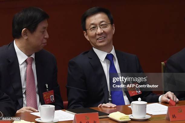 Han Zheng , secretary of the Shanghai Municipal Party Committee and member of the Political Bureau, talks to Li Zhanshu, secretary of the Central...