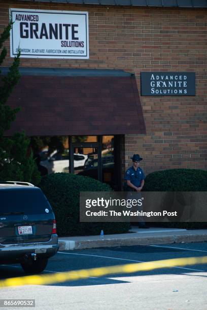 Advanced Granite Solutions is pictured guarded by a sheriff. A gunman opened fire at an Edgewood Maryland office park on Wednesday morning, October...