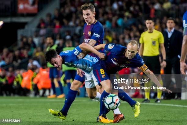 Juan Pablo Anor Acosta, Juanpi , of Malaga CF is tackled by Andres Iniesta Lujan of FC Barcelona during the La Liga 2017-18 match between FC...