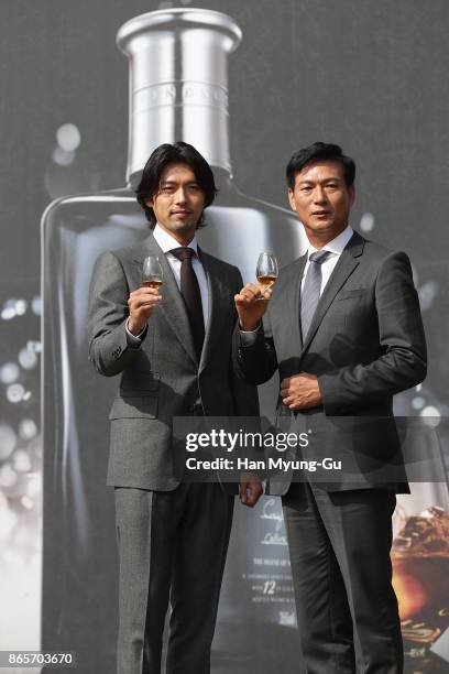 South Korean actor Hyun Bin and Cho Kil-Soo aka Kilsoo Cho, CEO of Diageo Korea attend Diageo Korea 'W Signature 12 by Windsor' Launch Photocall at...
