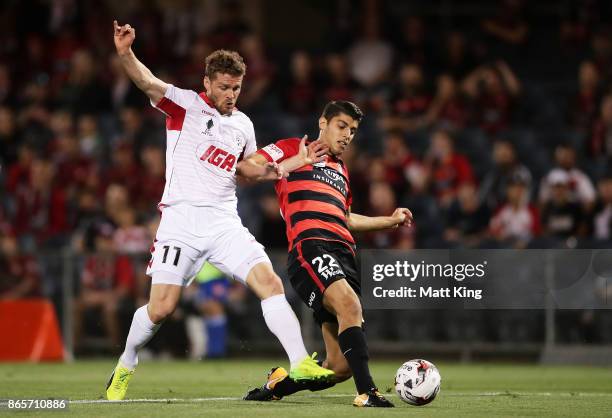 Johan Absalonsen of United beats Jonathan Aspropotamitis of the Wanderers to score the first goal during the FFA Cup Semi Final match between the...