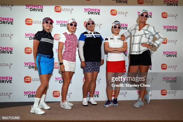 Natasha Oon of Malaysia, Kelly Tan of Malaysia, Shanshan Feng of China, So Yeon Ryu of South Korea and Anna Nordqvist of Sweden pose with their pink...