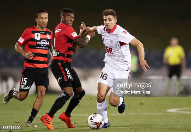 Nathan Konstandopoulos of United is challenged by Roly Bonevacia of the Wanderers during the FFA Cup Semi Final match between the Western Sydney...