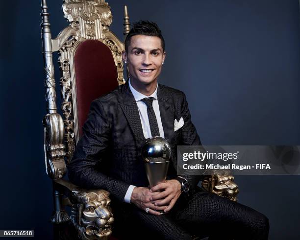 Cristiano Ronaldo of Portugal poses with The Best FIFA Men's Player 2017 trophy during The Best FIFA Football Awards at the London Palladium on...