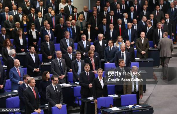 New parliamentarians of the right-wing Alternative for Germany - here seen in the central and right side of the frame - stand next to members of the...