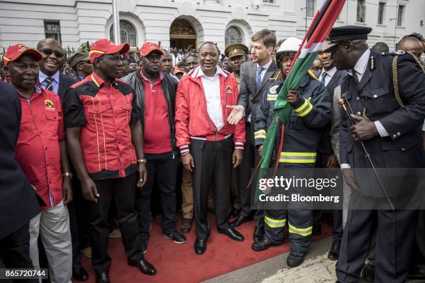 Uhuru Kenyatta, Kenya's president, center, looks on during a ceremony to inaugurate new fire engines for the Nairobi County government in Nairobi,...