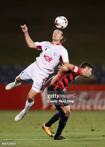 Michael Marrone of United is challenged by Alvaro Cejudo of the Wanderers during the FFA Cup Semi Final match between the Western Sydney Wanderers...