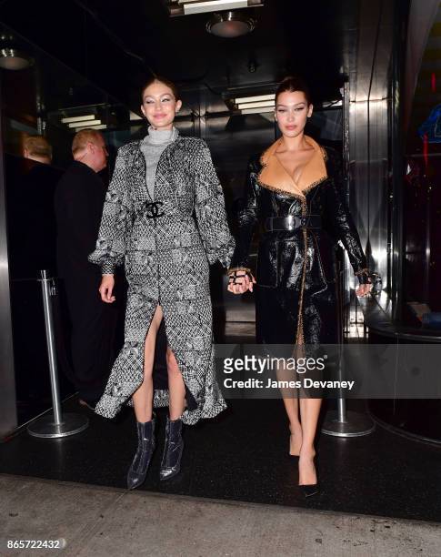 Gigi Hadid and Bella Hadid leave The Top of the Standard on October 23, 2017 in New York City.