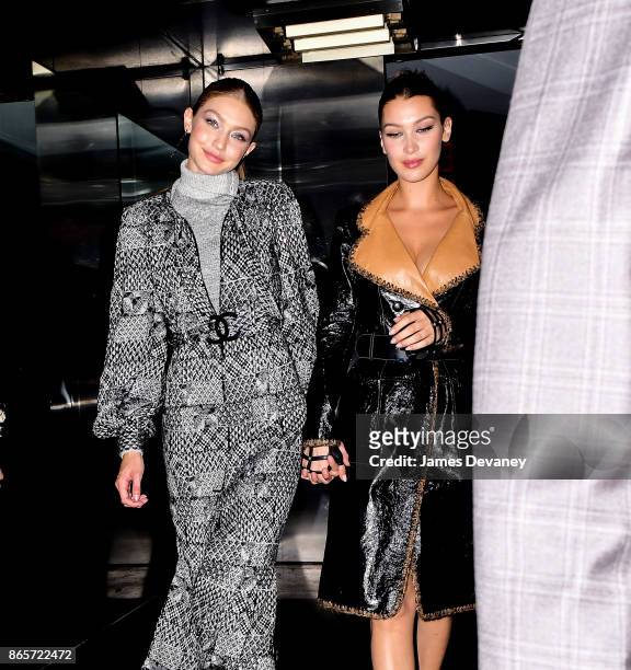 Gigi Hadid and Bella Hadid leave The Top of the Standard on October 23, 2017 in New York City.