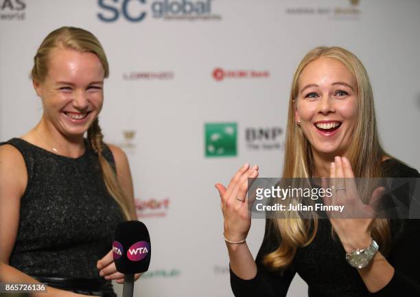 Kiki Bertens of Netherlands and Johanna Larsson of Sweden are interviewed during day 3 of the BNP Paribas WTA Finals Singapore presented by SC Global...