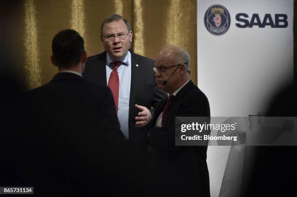 Hakan Buskhe, chief executive officer of Saab AB, center, attends an earnings news conference in Stockholm, Sweden, on Tuesday. Oct. 24, 2017....