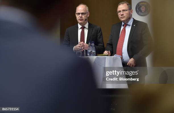 Magnus Ornberg, chief financial officer of Saab AB, left, speaks as Hakan Buskhe, chief executive officer of Saab AB, looks on during an earnings...