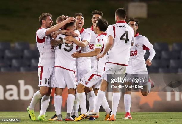 Daniel Adlung of United celebrates with team mates after scoring a goal during the FFA Cup Semi Final match between the Western Sydney Wanderers and...