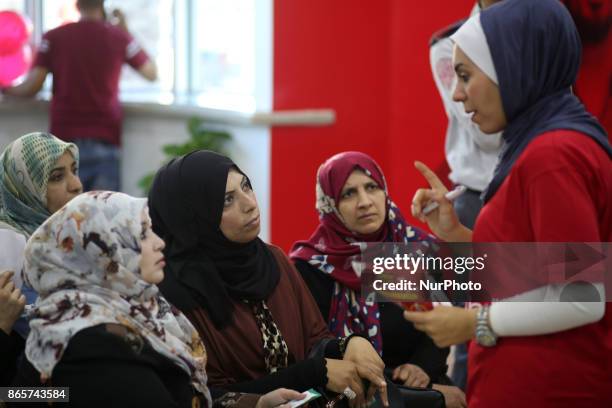 Palestinians wait to get their SIM card from Al-Wataniya Mobile Palestine after it launched services in Gaza City October 24, 2017.