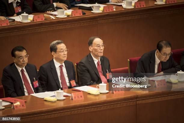 Li Keqiang, China's premier, from left, Yu Zhengsheng, chairman of the Chinese People's Political Consultative Conference , Wang Qishan, secretary of...