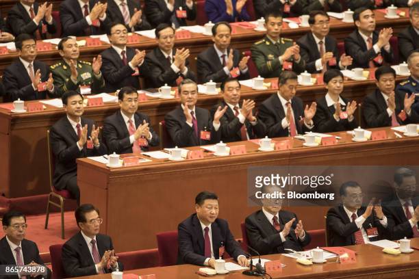 Zhang Dejiang, chairman of the Standing Committee of the National People's Congress, front row from left, Hu Jintao, China's former president, Xi...