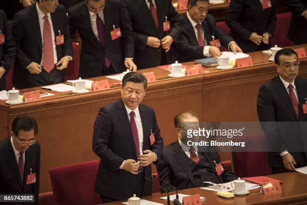 Hu Jintao, China's former president, front row from left, Xi Jinping, China's president, Jiang Zemin, China's former president, and Li Keqiang,...