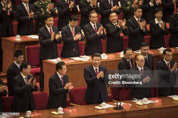 Zhang Dejiang, chairman of the Standing Committee of the National People's Congress, front row from left, Hu Jintao, China's former president, Xi...