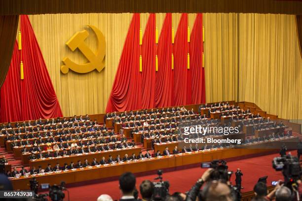 Xi Jinping, China's president, front row center, and other leaders and delegates attend the closing session of the 19th National Congress of the...