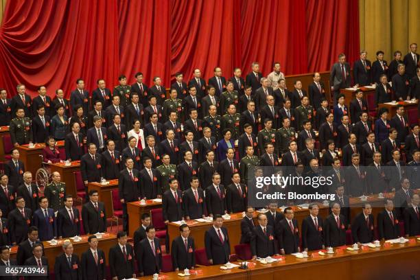 Xi Jinping, China's president, front row center, and other leaders and delegates attend the closing session of the 19th National Congress of the...