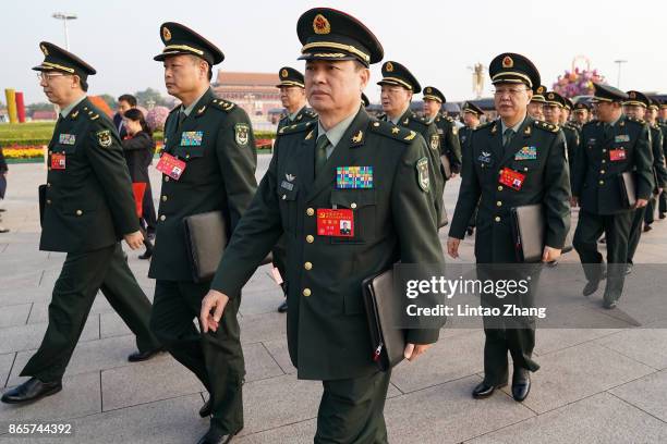 Members of the People's Liberation Army on their way to attend the closing of the 19th Communist Party Congress at the Great Hall of the People on...