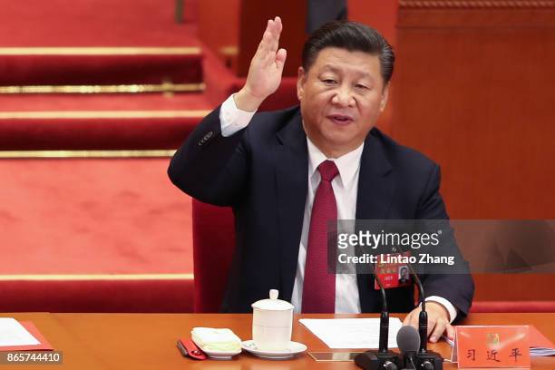 Chinese President Xi Jinping vote at the closing of the 19th Communist Party Congress at the Great Hall of the People on October 24, 2017 in Beijing,...