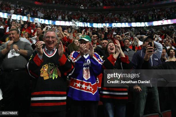 Fans of the Chicago Blackhawks celebrate their 2-1 overtime win against the Vancouver Canucks during Game Four of the Western Conference Semifinal...