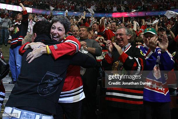 Fans of the Chicago Blackhawks celebrate their 2-1 overtime win against the Vancouver Canucks during Game Four of the Western Conference Semifinal...