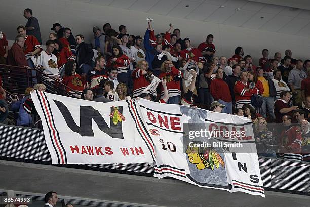 Chicago Blackhawks fans celebrate after beating the Vancouver Canucks in overtime to win Game Four of the Western Conference Semifinal Round of the...