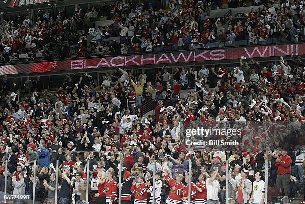 Chicago Blackhawks fans celebrate after beating the Vancouver Canucks in overtime to win Game Four of the Western Conference Semifinal Round of the...