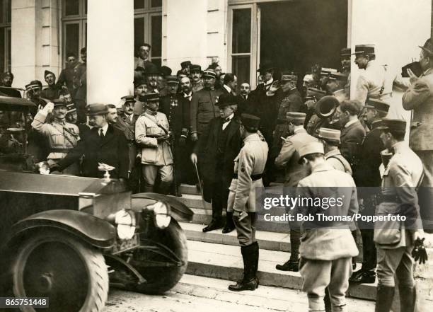 Lloyd George, British Prime Minister, leaving the Trianon Palace after handing over terms of defeat to Germany which resulted in the Treaty of...
