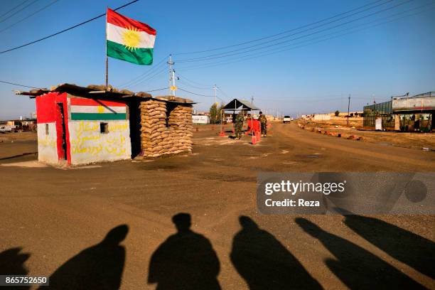 Shadows of Peshmerga combatants near the Snuny Checkpoint, near the area of the same name, along the main road between the towns of Duhok and...