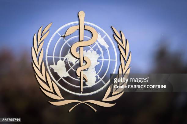 The logo of the World Health Organization is pictured on the facade of the WHO headquarters on October 24, 2017 in Geneva. - The head of the World...
