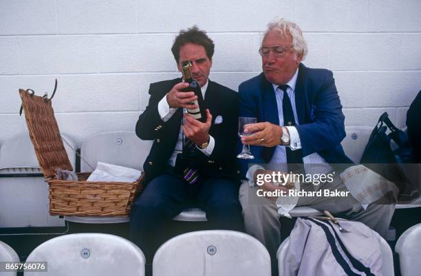 Gentlemen fans of cricket enjoy drinks and a day out during the test match between England and New Zealand on 21st August 1999, at the Oval ground,...