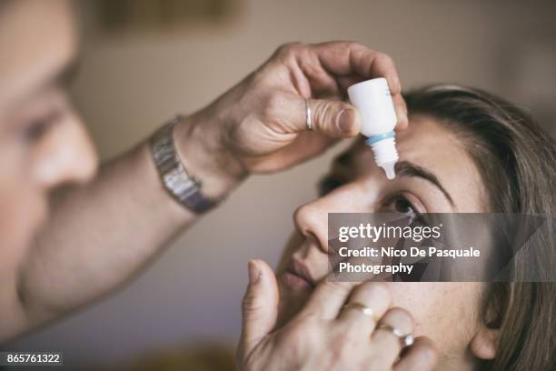 applying eye drops - eyedropper stock pictures, royalty-free photos & images