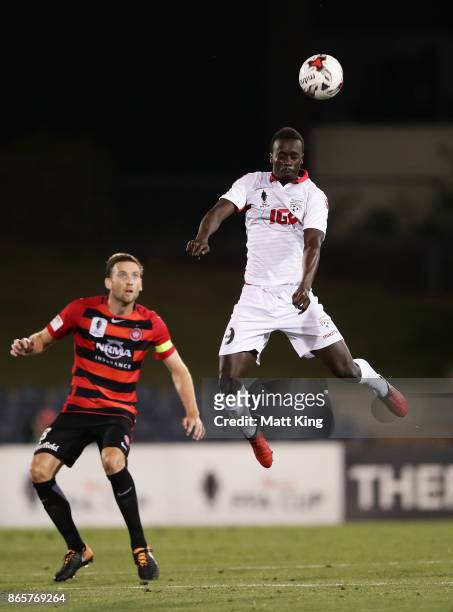 Papa Diawara of United heads the ball during the FFA Cup Semi Final match between the Western Sydney Wanderers and Adelaide United at Campbelltown...